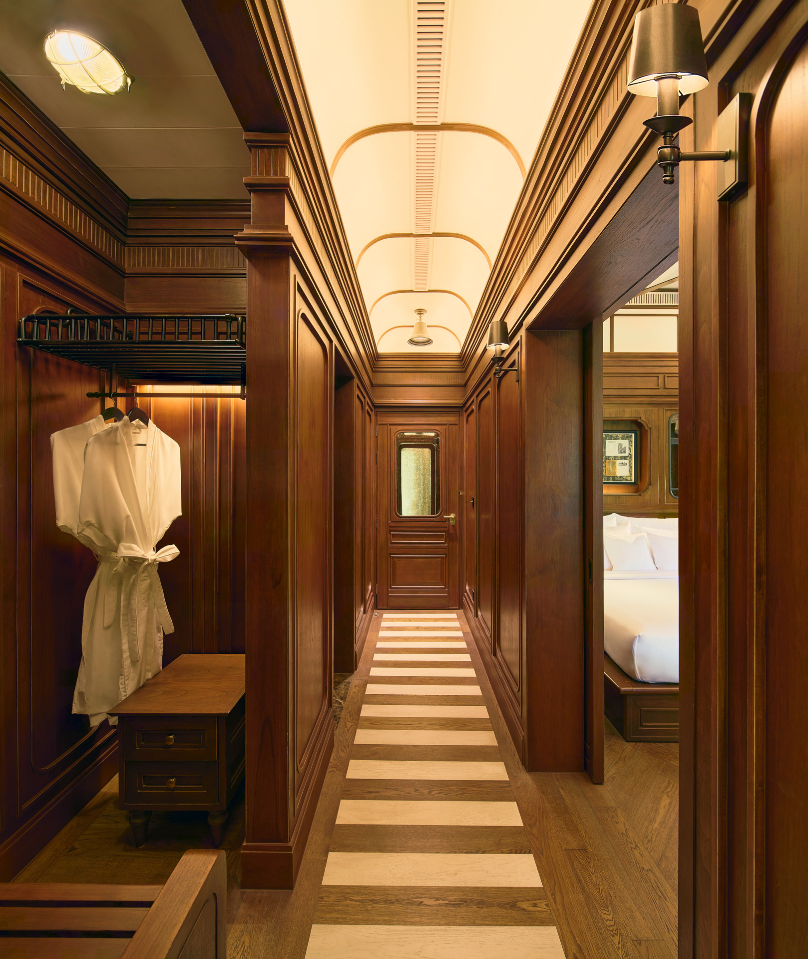 a train-themed hotel suite with brown wood paneling at intercontinental khao yai resort